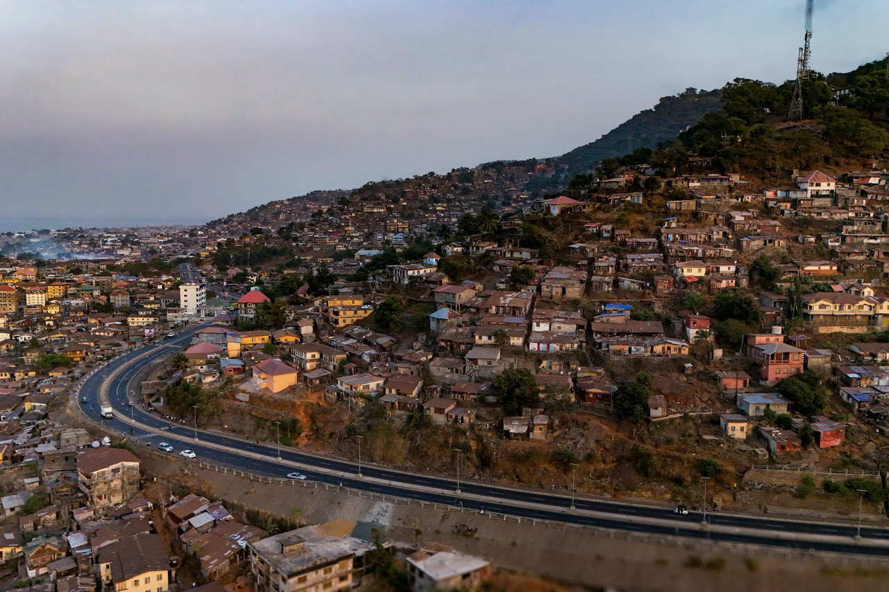 Aerial view of Freetown hillside housing at dusk